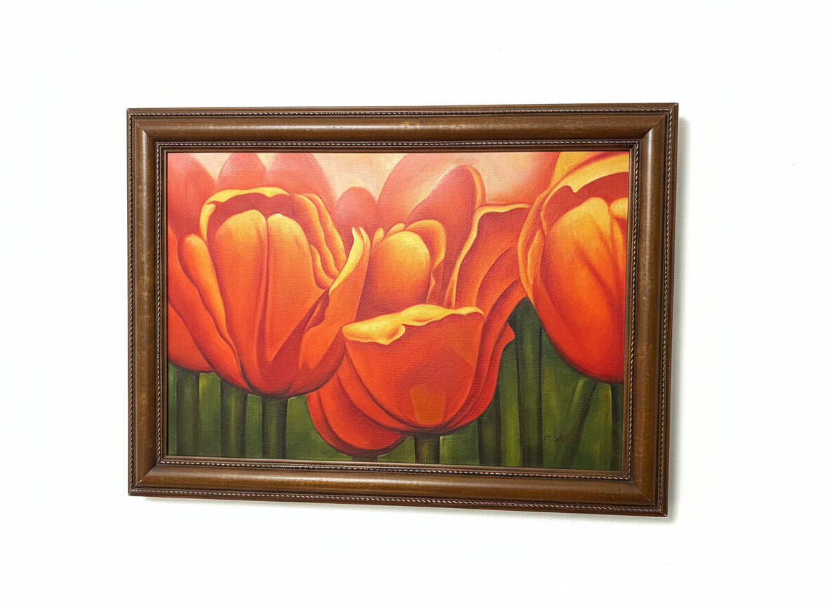 Framed painting of red tulips on a gray background