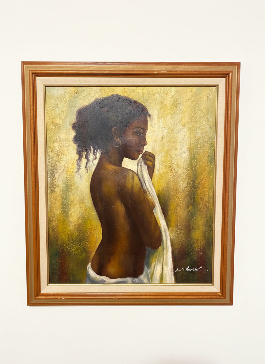 Framed painting of a woman with a white scarf, set against a textured gold background.